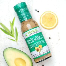 Primal Kitchen Green Goddess dressing bottle pour, herby finish perfect as dip or marinade.