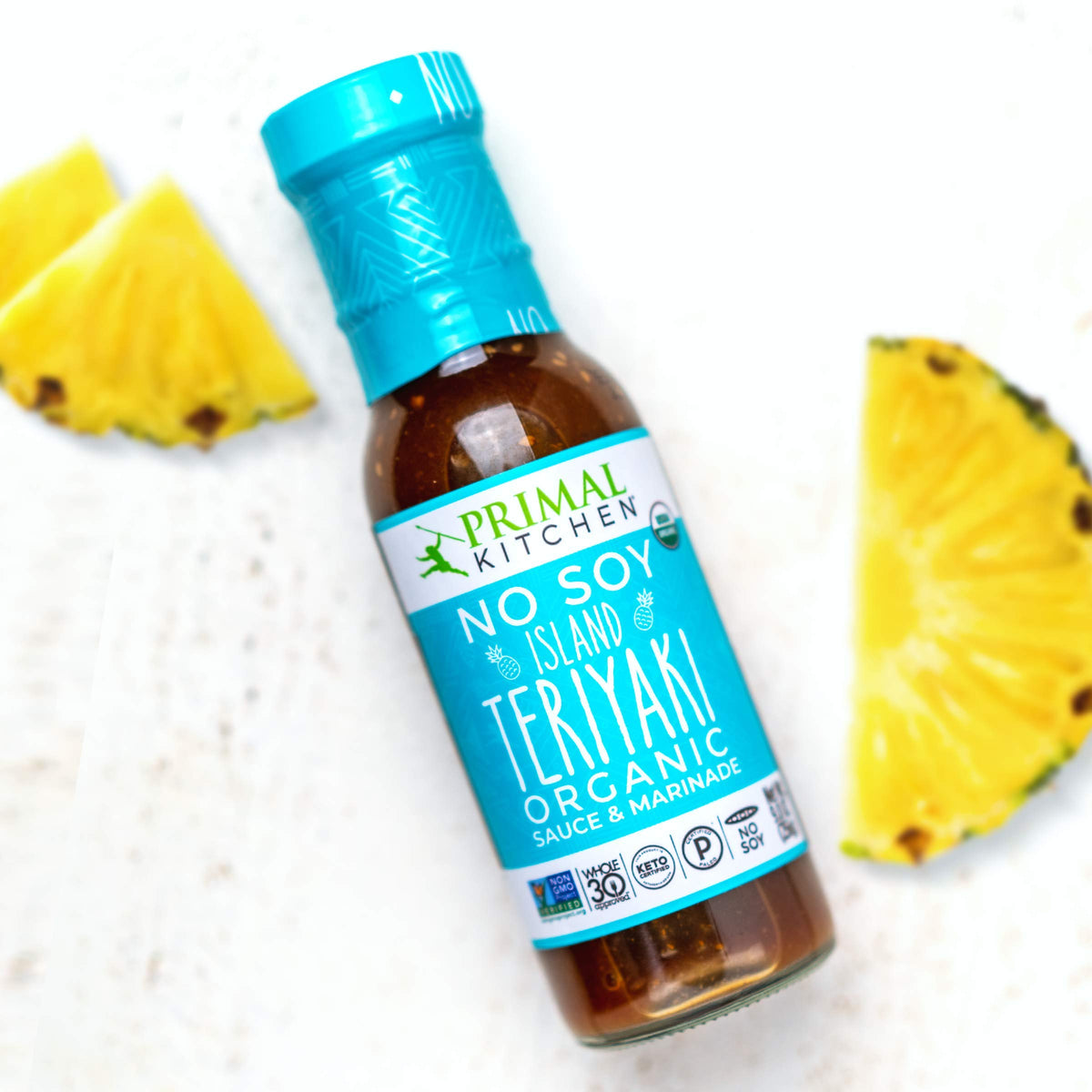 Primal Kitchen No-Soy Island Teriyaki bottle glaze emphasizes pineapple notes for dipping and glazing.