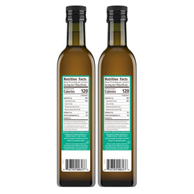 Primal Kitchen EVOO being poured over salad for flavor.