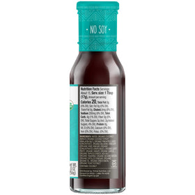 Primal Kitchen Original No-Soy glaze over grilled meat highlights bold, savory aroma and caramelized edges.