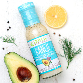 Close-up of Primal Kitchen Ranch dressing ingredients with avocado oil base for savory dressing.