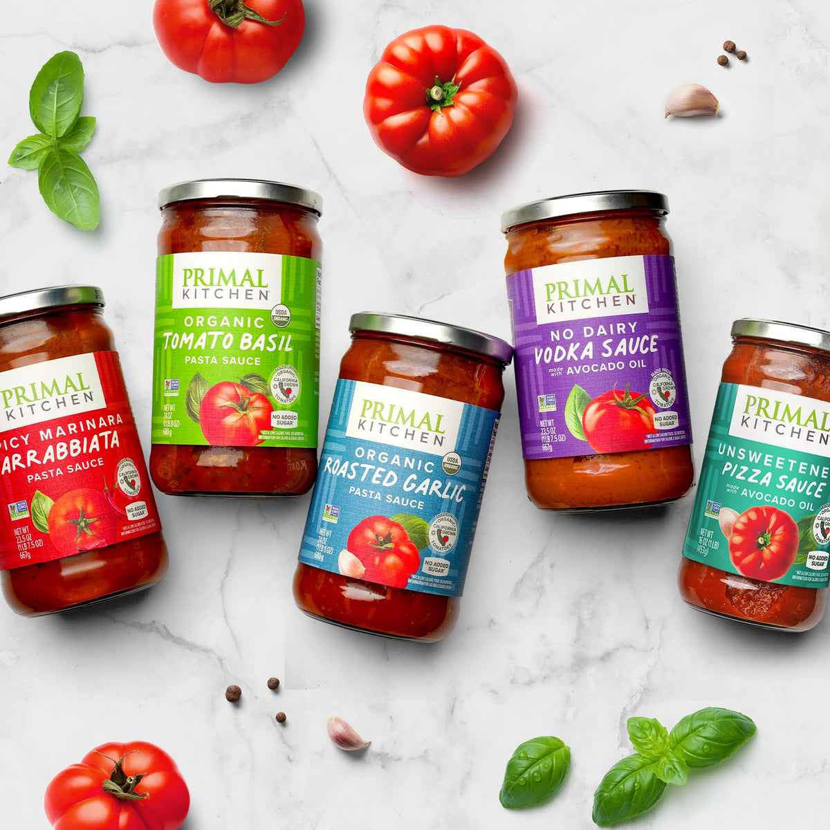 Primal Kitchen red pizza sauce plated ready for serving with cheese and toppings