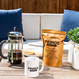Primos Coffee Co. coarse-ground brew signifies ideal French press extraction.