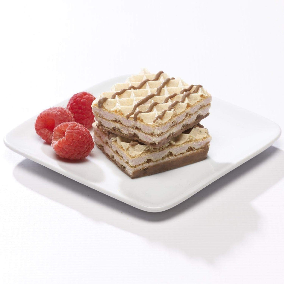 Close-up of Proti-Thin Raspberry Wafer Squares with raspberry filling and chocolate finish.