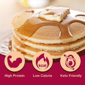 Golden ProtiDIET pancakes cooking in a pan with fluffy texture.