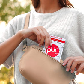PUR Gum Cinnamon packaging highlights allergen-free, vegan, gluten-free credentials for dietary needs.