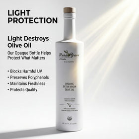 Pura Grove bottle pouring olive oil, ideal for drizzling on salads.