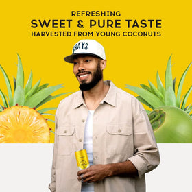 Pure Coconut Water 100 pineapple-flavored drink near workout setup for thirst-quenching option.