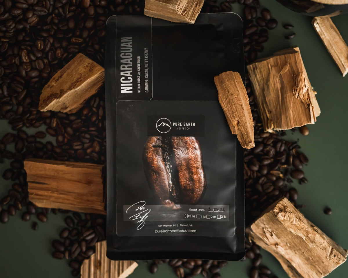 Pure Earth Coffee Co steaming cup displaying rich mouthfeel and cocoa finish