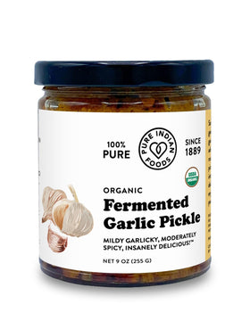 Pure Indian Foods Fermented Garlic Pickle jar with vibrant color, ideal condiment for enhancing meals