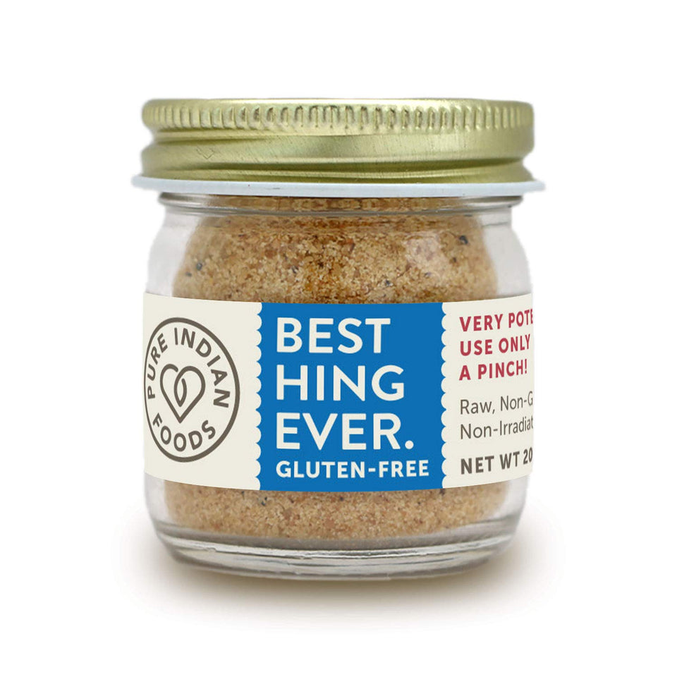 Pure Indian Foods Hing powder in glass bottle for authentic flavor enhancement.