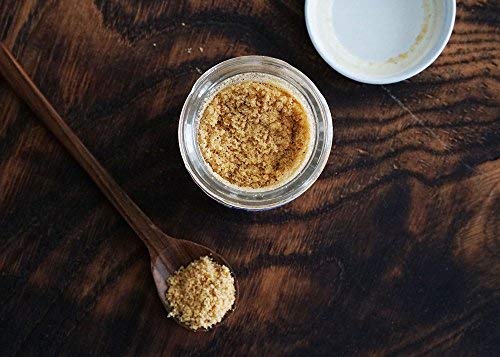 Pure Indian Foods Hing powder pour focus shows easy dosing.
