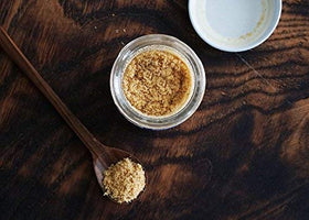 Pure Indian Foods Hing powder pour focus shows easy dosing.