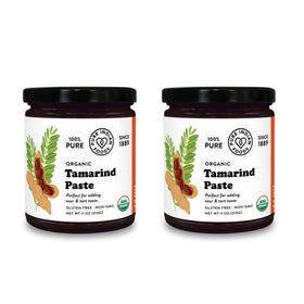 Pure Indian Foods tamarind paste concentrate in a glass jar, ideal for chutneys and curries.