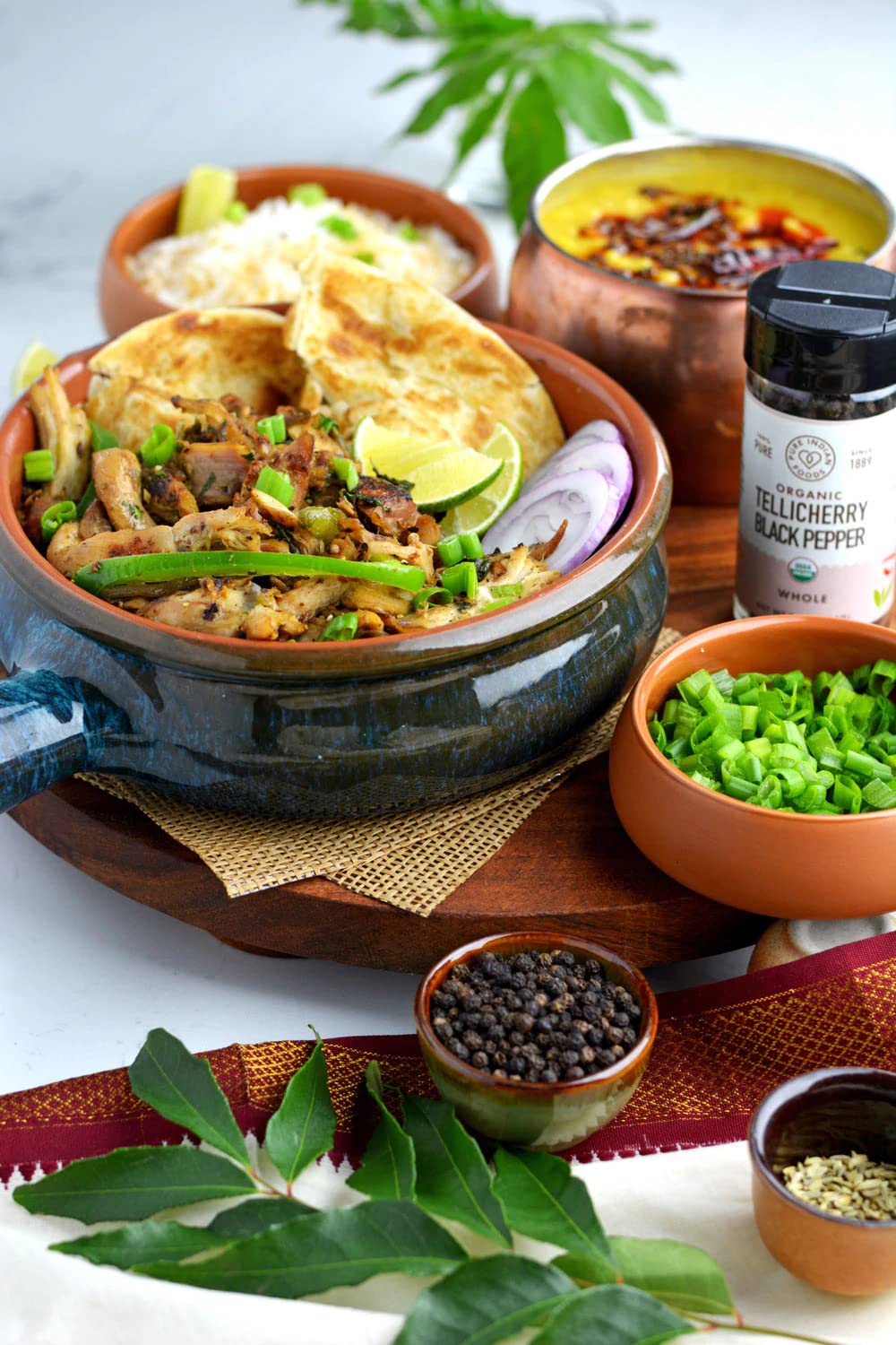 Pure Indian Foods Tellicherry peppercorns ground spice for easy seasoning.