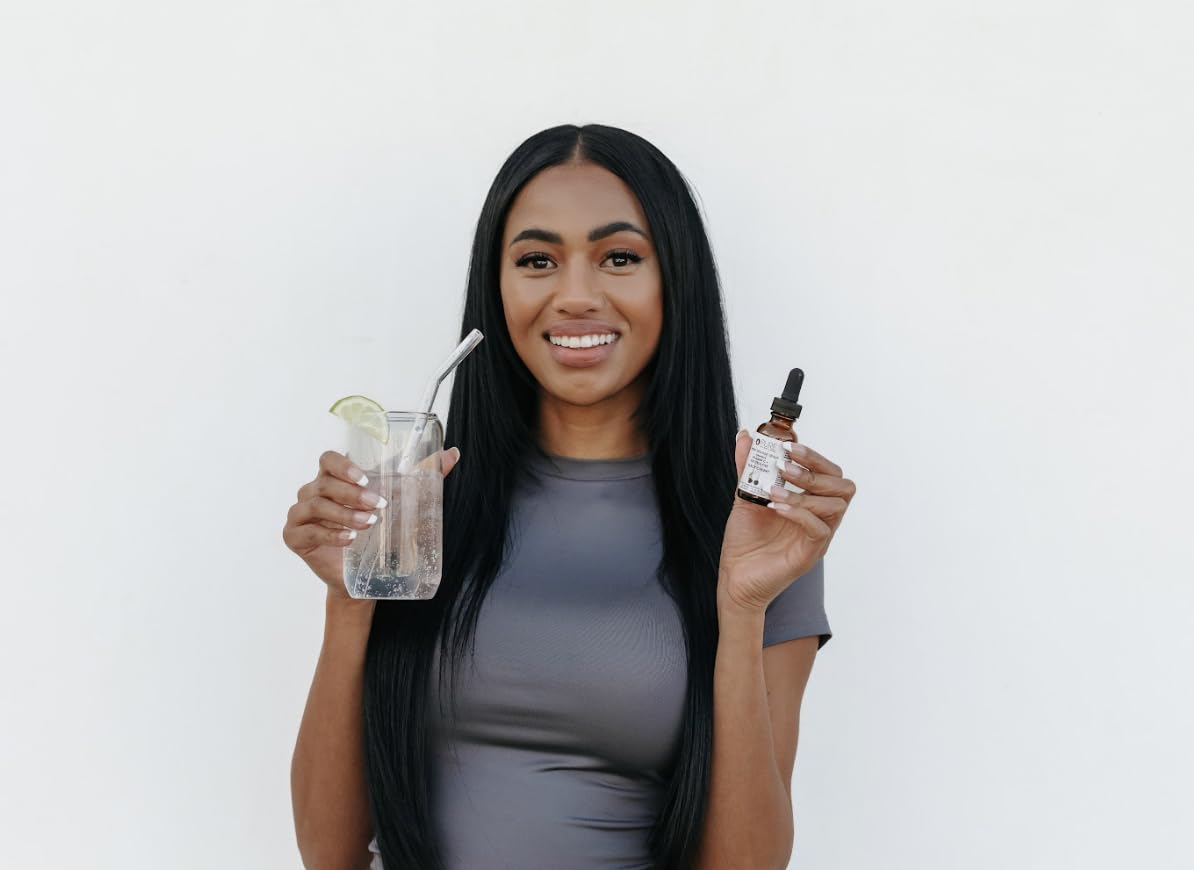 Pure Inventions packaging displays eco-friendly glass bottle for sustainable wellness.