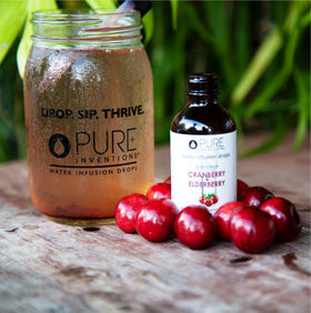 Pure Inventions product shot with cranberry-elderberry tones conveys refreshing flavor.