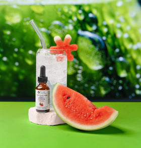 Glass filled with water and drops showing hydration convenience from Pure Inventions