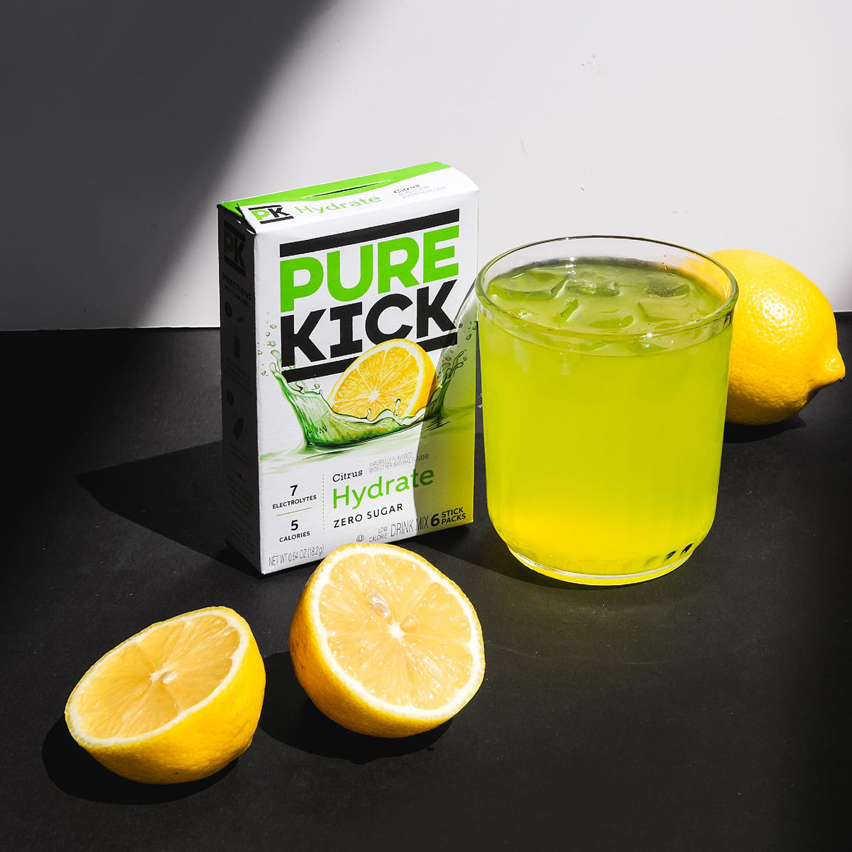 PURE KICK Citrus glass with water shows vibrant color and balanced taste.