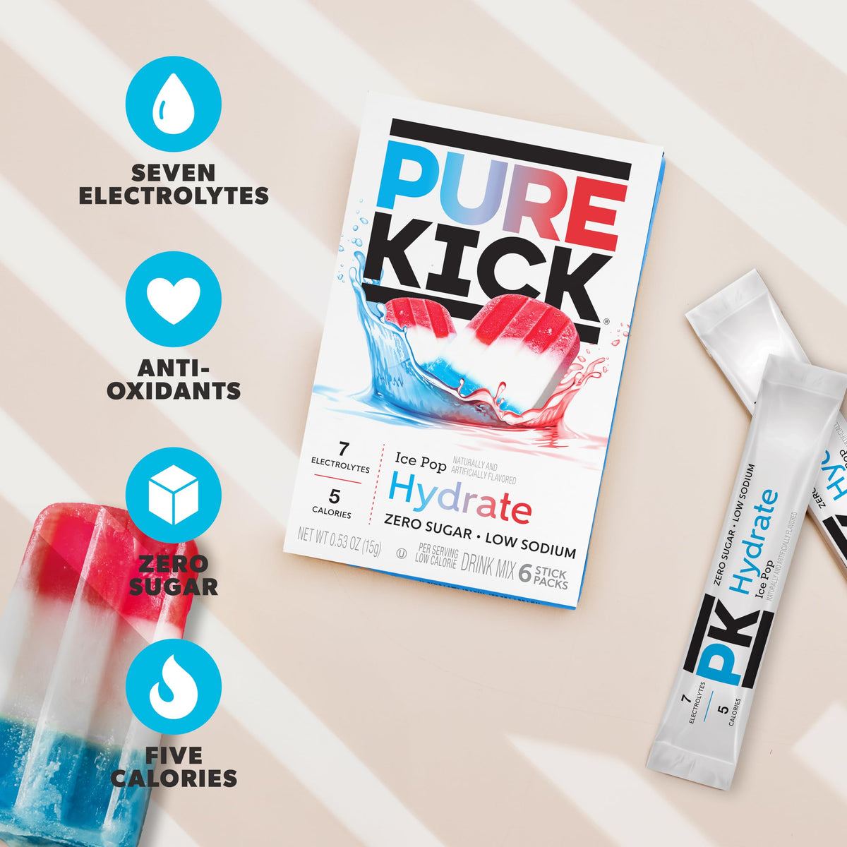 Pure Kick Hydrate Ice Pop in a glass of water shows bold, refreshing flavor.