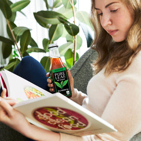 Pure Leaf 18.5 oz bottle poured over ice for cooling refreshment.