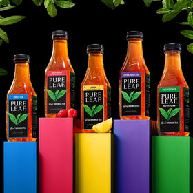Chilled Pure Leaf Peach Iced Tea in a glass with ice, inviting summer vibes.