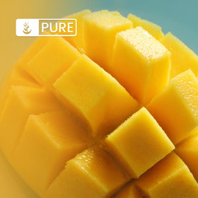 Pure Original Ingredients mango powder being poured into a glass to mix drinks