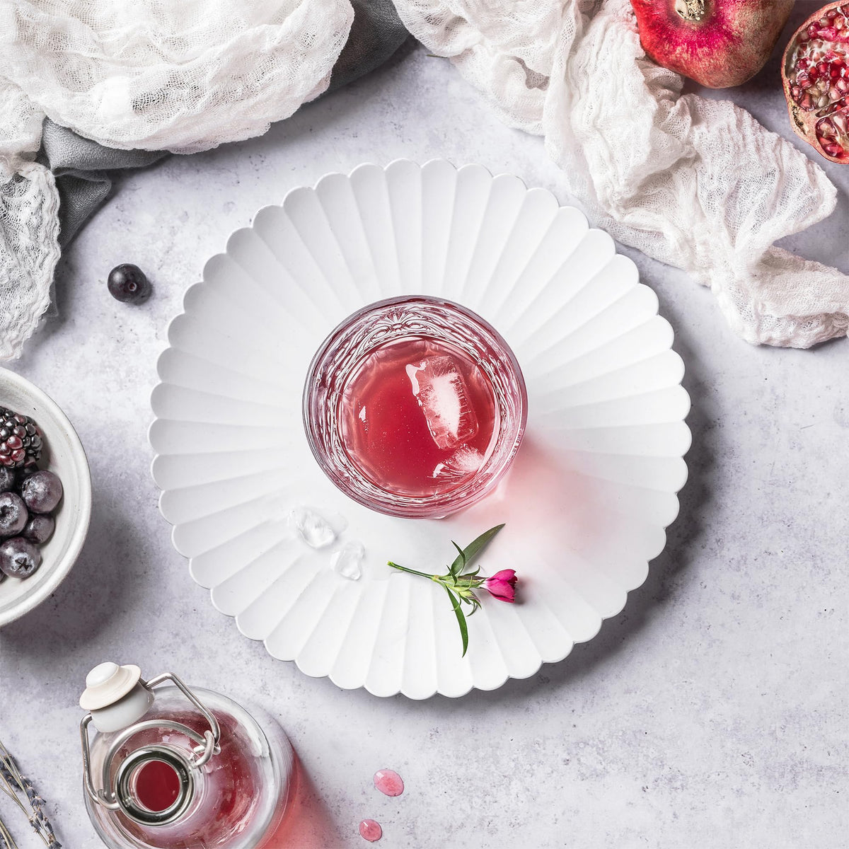 Pure Original Ingredients pomegranate bottle label highlights vegan, non-GMO quality.