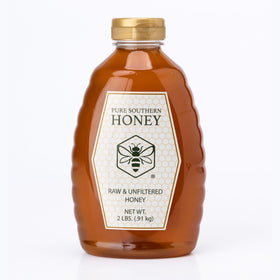 Pure Southern Honey raw unheated honey pour captures thick, golden texture.