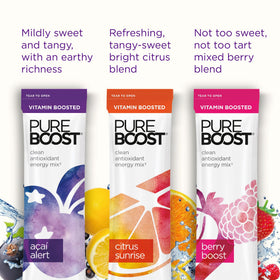 Pureboost single-serve packets being poured into water for quick hydration.