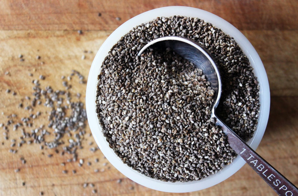 Pure Living chia seeds sprinkled on yogurt bowl for texture and nourishment.
