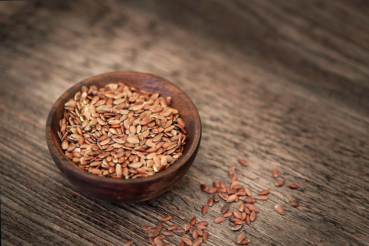 Close-up of Pure Living sprouted flax seeds highlighting their nutty aroma.