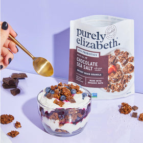 Purely Elizabeth ancient grain granola chocolate sea salt serving in milk bowl