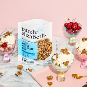 Purely Elizabeth granola clusters close-up, showing toasted oats and chocolate chips.