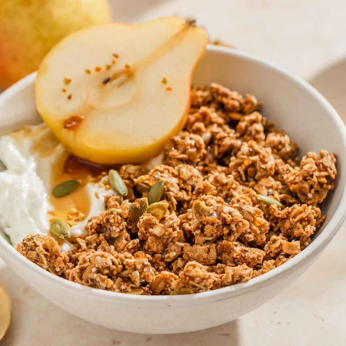 Purely Elizabeth granola with milk or yogurt for a balanced breakfast