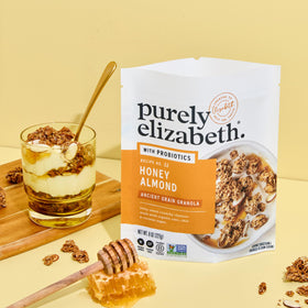 Serving Purely Elizabeth granola with yogurt and fruit for a balanced meal