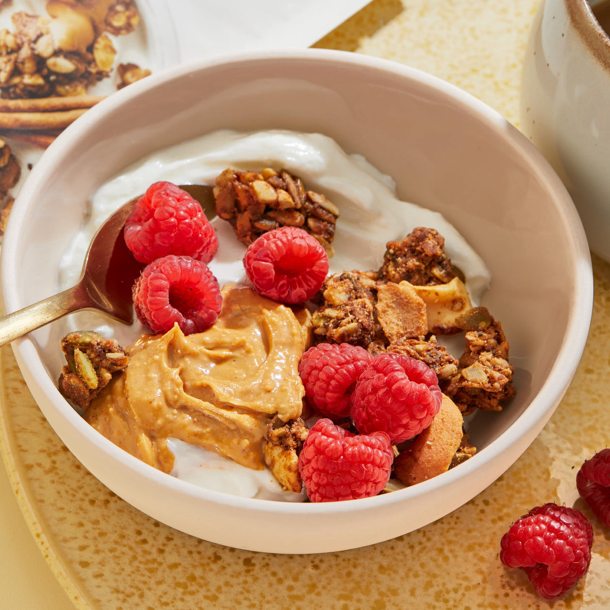 Purely Elizabeth MCT oil granola being poured for a convenient on-the-go snack