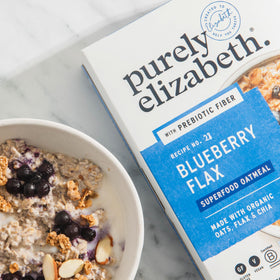 Purely Elizabeth oatmeal bowl with cinnamon, inviting morning texture.