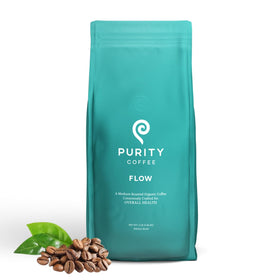 Purity Coffee FLOW Original bag close-up emphasizing premium whole beans and rich aroma.
