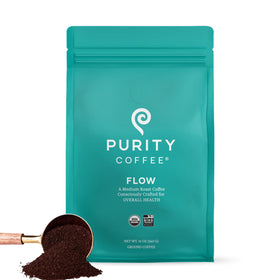 Purity Coffee FLOW Original bag visible, signaling premium organic coffee for a clean morning ritual.