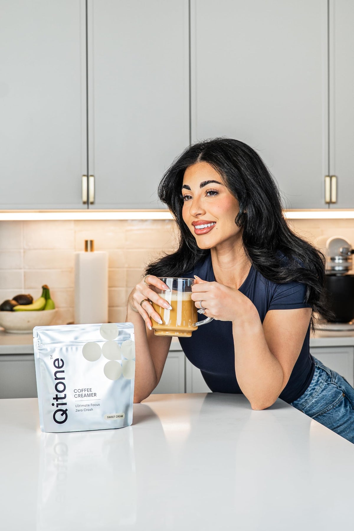 Qitone Keto Coffee Creamer cup with hot beverage and creamy texture