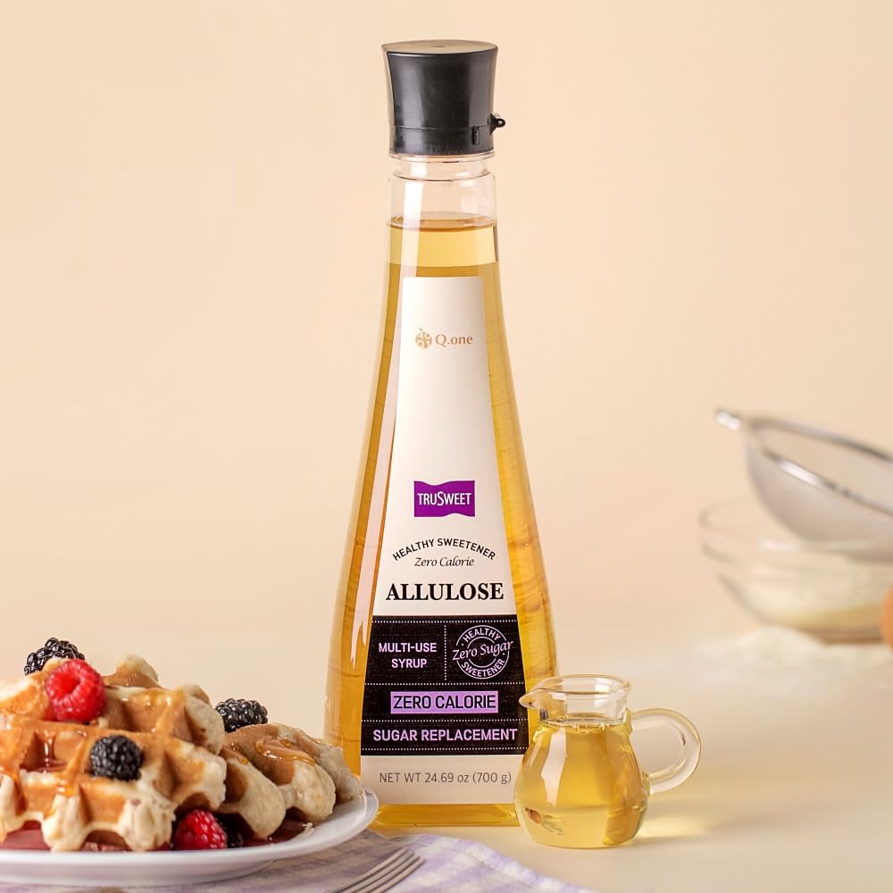 Pouring q.one Trusweet allulose syrup over pancakes for a sugar-free drizzle