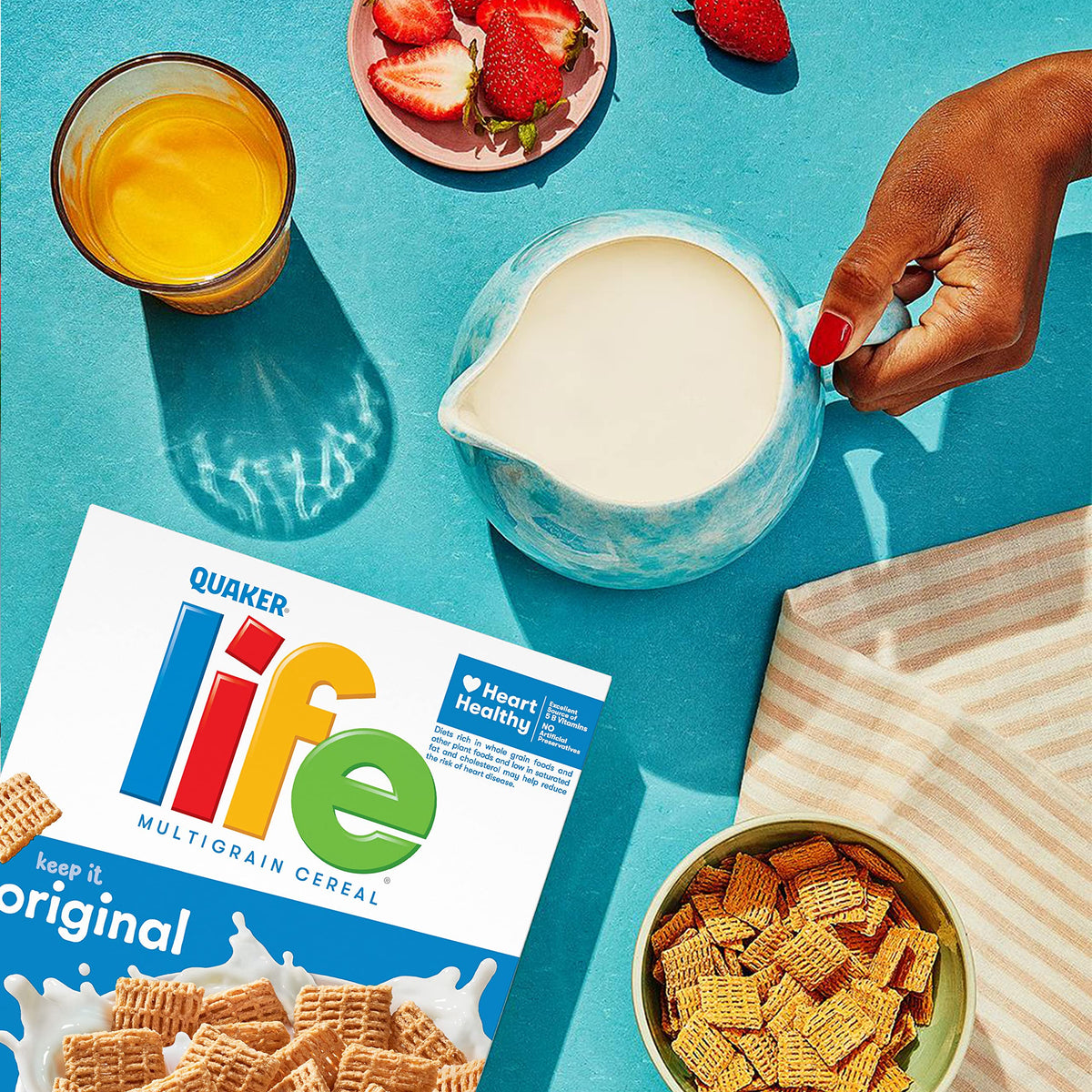 Three boxes of Quaker Life Cereal Original 13oz shown for family mornings