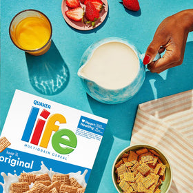 Three boxes of Quaker Life Cereal Original 13oz shown for family mornings