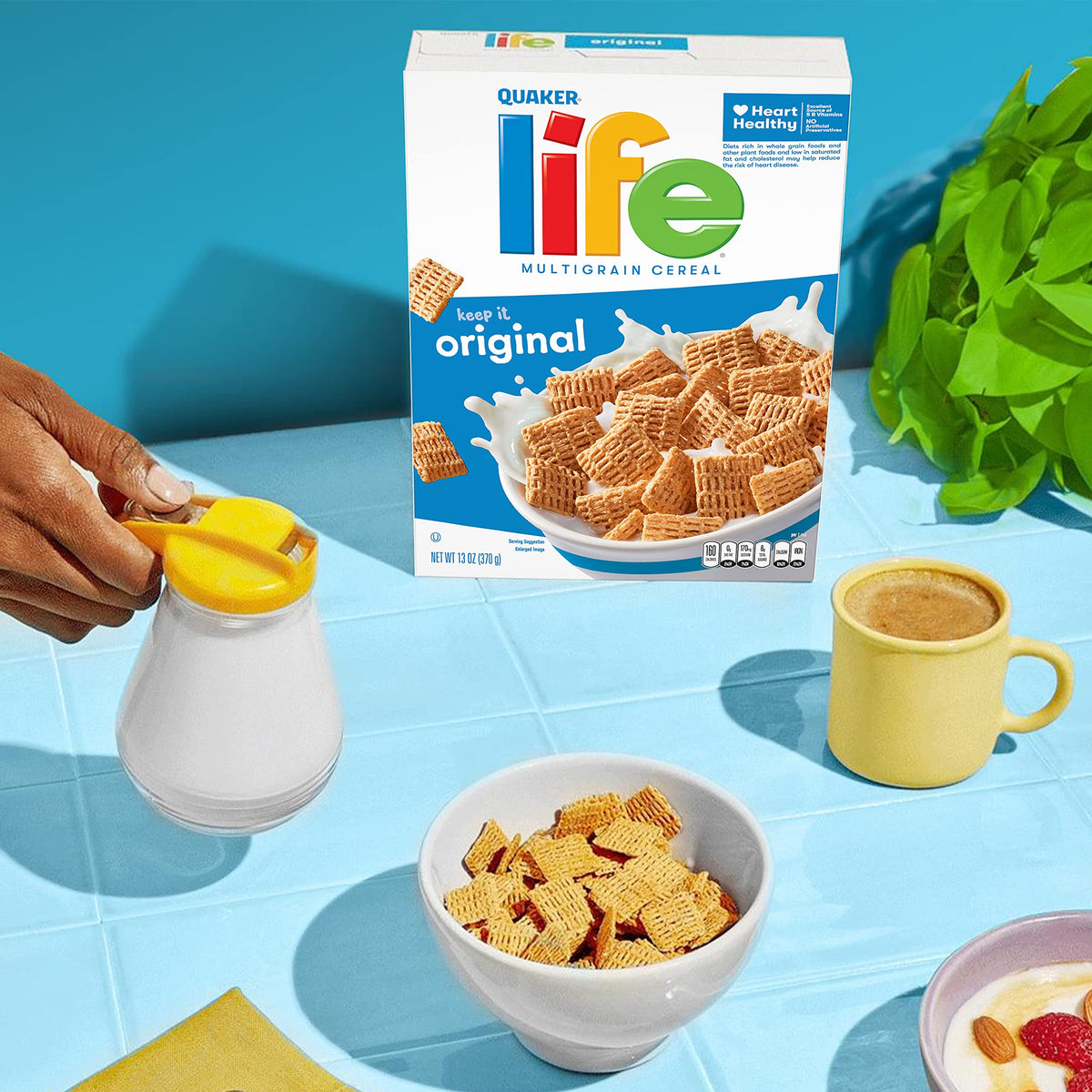 Pouring Quaker Life Cereal Original into a bowl