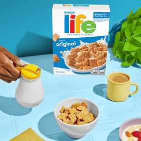 Pouring Quaker Life Cereal Original into a bowl