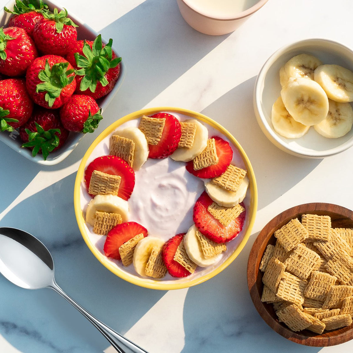 Milk and fruit with Quaker Life Cereal Original for a balanced breakfast