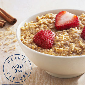 Quaker oatmeal with a spoonful of oats, ready in minutes for busy mornings.