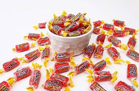 QUEEN CITY CANDY CAVE Bright watermelon candy ideal for celebrations.