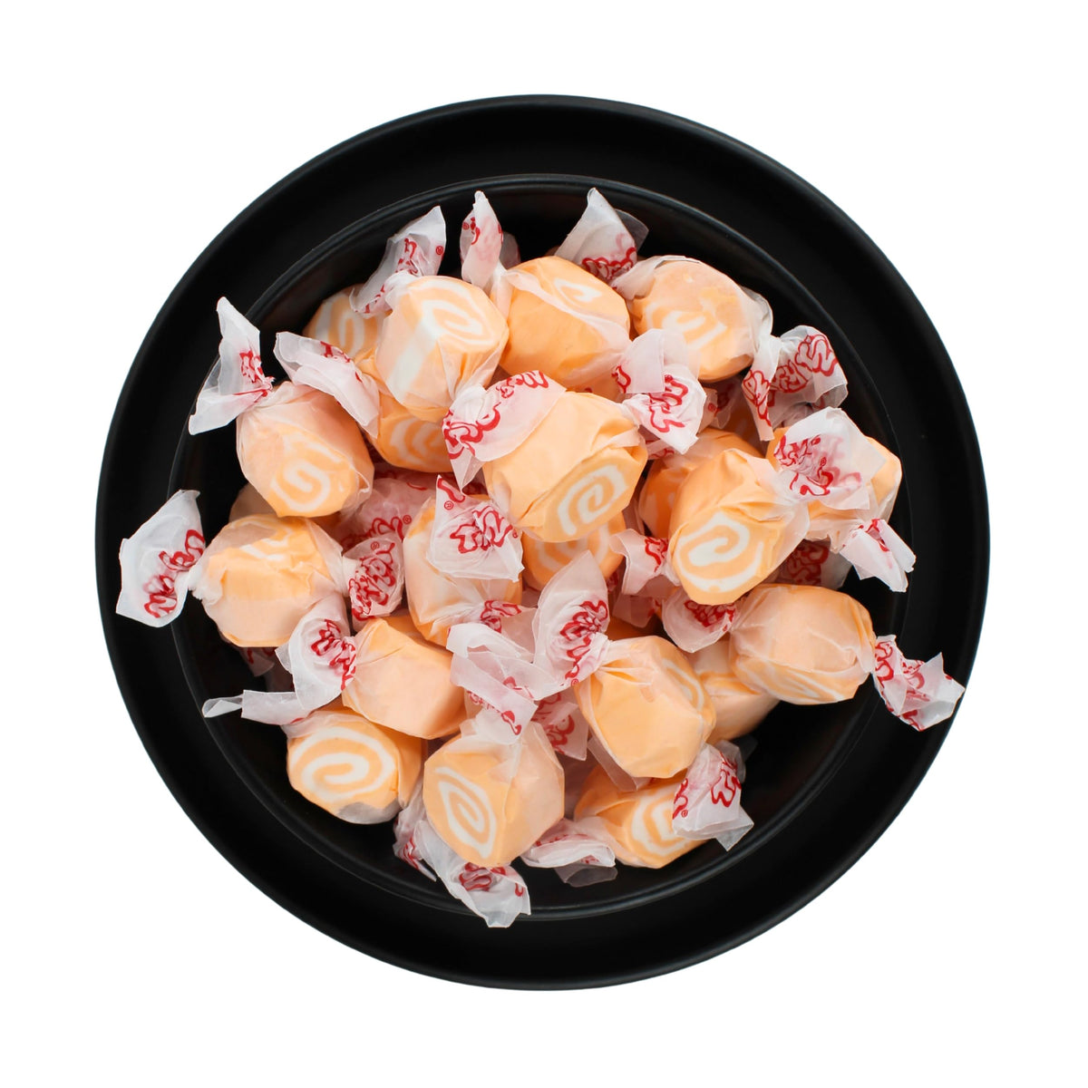 Chewy, soft texture visible in orange-and-white taffy for Easter egg hunts